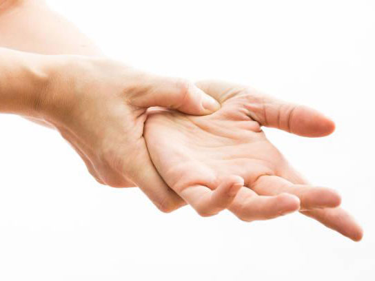 A person's hand pushing on pressure points of their other hand icon