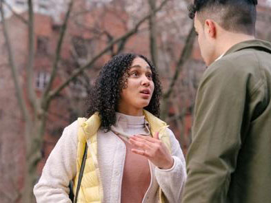 A woman talking to a man with a look of concern on her face icon