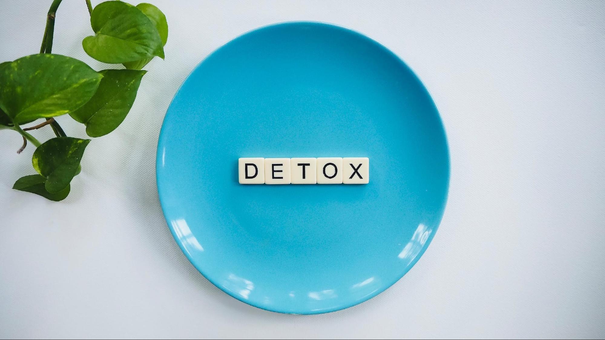 A blue plate with tiles spelling "detox" in the center icon