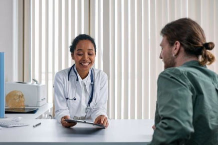 person speaking with their doctor icon
