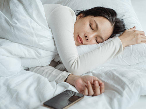 A woman sleeping contentedly icon